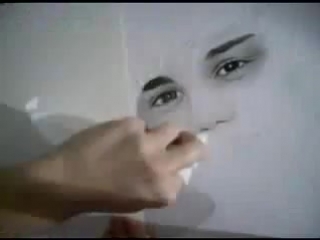 the girl draws with a simple pencil. justin bieber